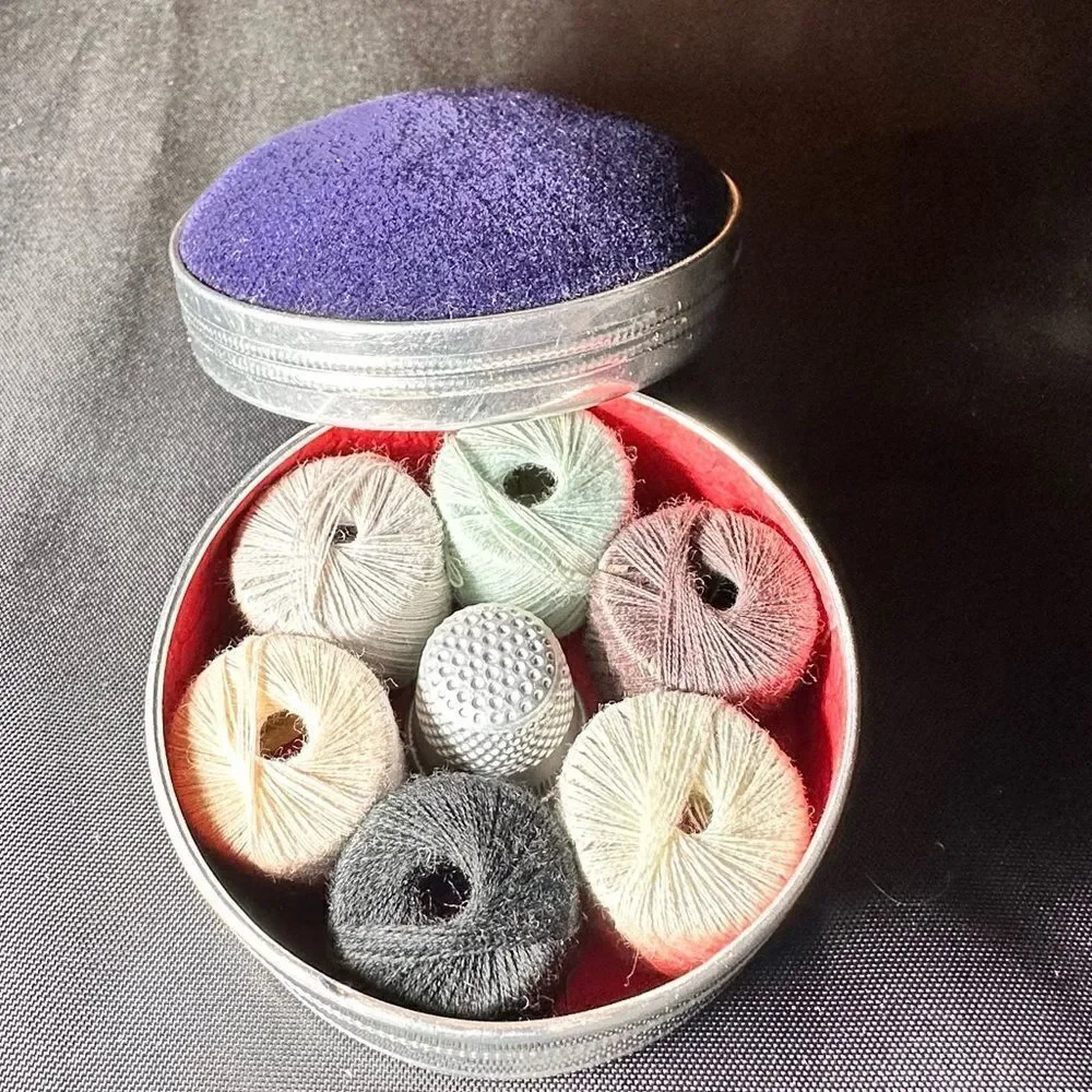 Vintage 1950s round pin cushion sewing tin complete with thread